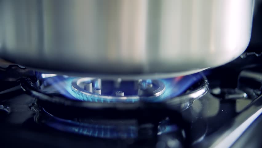 Kitchen Burner Blue Gas Fire Of Stove. Light Gas Cooker. Chef Cooking Food. Appearing Blue Flame On Gas Stove. Roasted Cooking On Kitchen Stove. Blaze Lit Burner Glowing Flammable Methane Or Propane Royalty-Free Stock Footage #1101767395