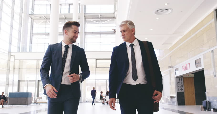 Businessmen, welcome handshake and walking in office, thank you and greeting in morning, smile and happy. Corporate worker, shaking hands and partnership with trust, b2b and work deal in the morning Royalty-Free Stock Footage #1101771811