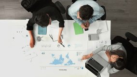 Global statistics, world map and business people meeting, analytics and data analysis, planning or strategy in marketing agency. Top view of international market, teamwork ideas and workshop research - Powered by Shutterstock - Get 15% off with code: PIKWIZARD15