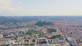 Inscription on video. Graz, Austria. The historic city center aerial view. Mount Schlossberg (Castle Hill). Lightning strikes the letters, Aerial View, Point of interest