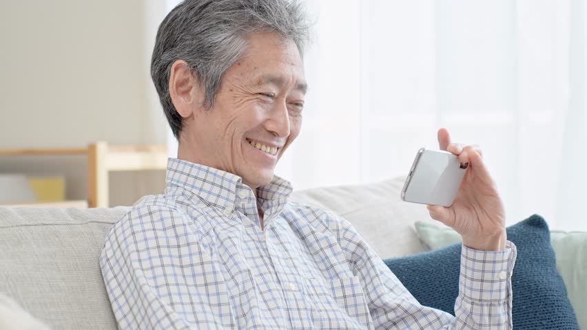 Japanese man looking at mobile phone