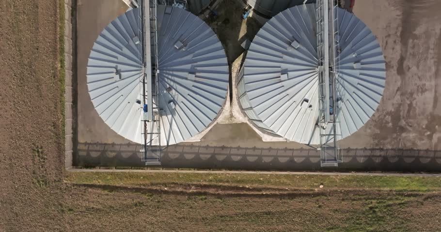 aerial view of agro-industrial complex with silos and grain drying line Royalty-Free Stock Footage #1101774789