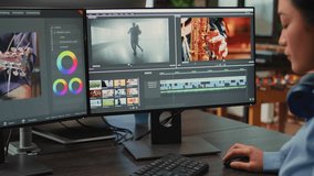 Videography expert editing video footage in post production agency house, improving montage quality on creative software. Video editor working on movie or film lighting, filmmaking industry.
