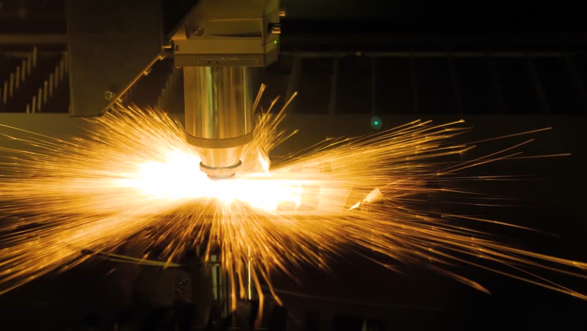 Automatic cnc laser cutting machine working with sheet metal with many orange sparks at plant, factory. Metalworking, industrial, manufacturing, technology and equipment concept | Shutterstock HD Video #1101779389