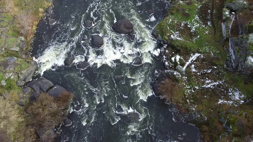 Aerial of River with White Water Rapids And Rock Boulders