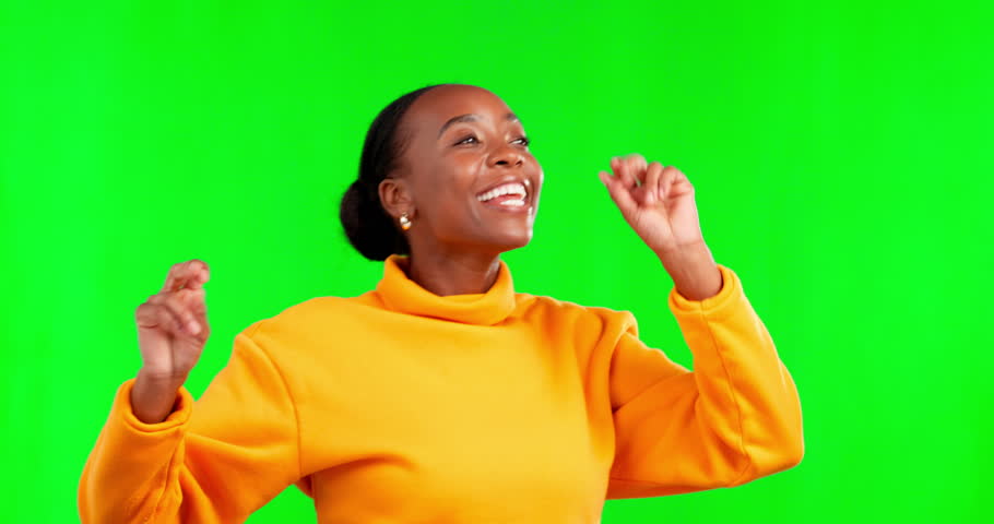 Face, green screen and black woman with celebration, dance and happiness against a studio background. Portrait, African American female and happy lady with smile, dancing and movement for achievement Royalty-Free Stock Footage #1101784993