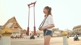 Beautiful young Asian tourist woman on vacation sightseeing and exploring Bangkok city, Thailand, Holidays and traveling concept	
