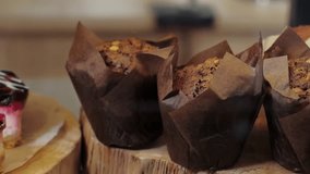 Panning video of chocolate muffin on shop in cafe