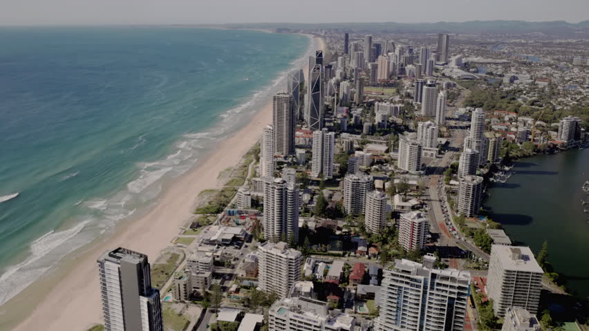 a sunny morning tilt down clip of surfers paradise looking south from the Q1 building in queensland, australia