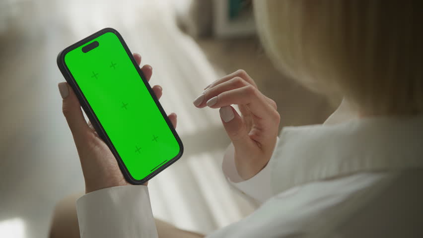 Single tap on smartphone with green screen in notifications area