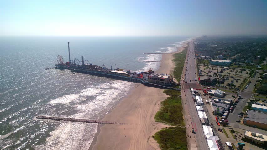 Galveston Island Historic Pleasure Pier on a sunny day - aerial view
