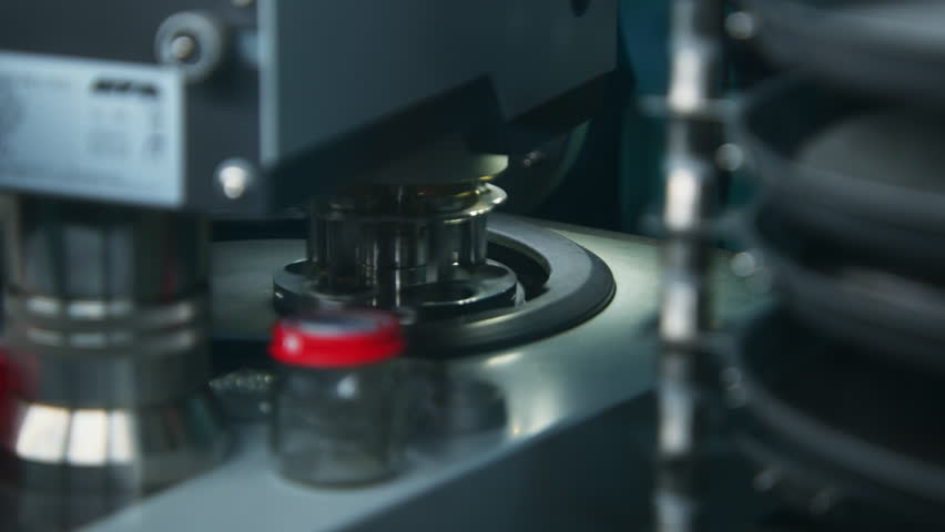 Close up of metal tubes of biochemical analyzer. Stock footage. Concept of medicine and research.