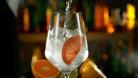 Super Slow Motion Shot of Pouring Gin and Tonic Into Long Glass with Camera Motion at 1000fps. - Powered by Shutterstock - Get 15% off with code: PIKWIZARD15