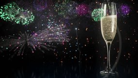 Animation of glittering text happy new year, with confetti, fireworks and champagne glass, on black. celebration, new year, party and event concept digitally generated video.