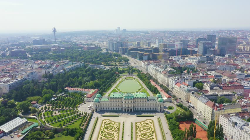 Inscription on video. Vienna, Austria. Belvedere is a baroque palace complex in Vienna. Built by Lucas von Hildebrandt at the beginning of the 18th century. Flames with dark fire, Aerial View, Depart