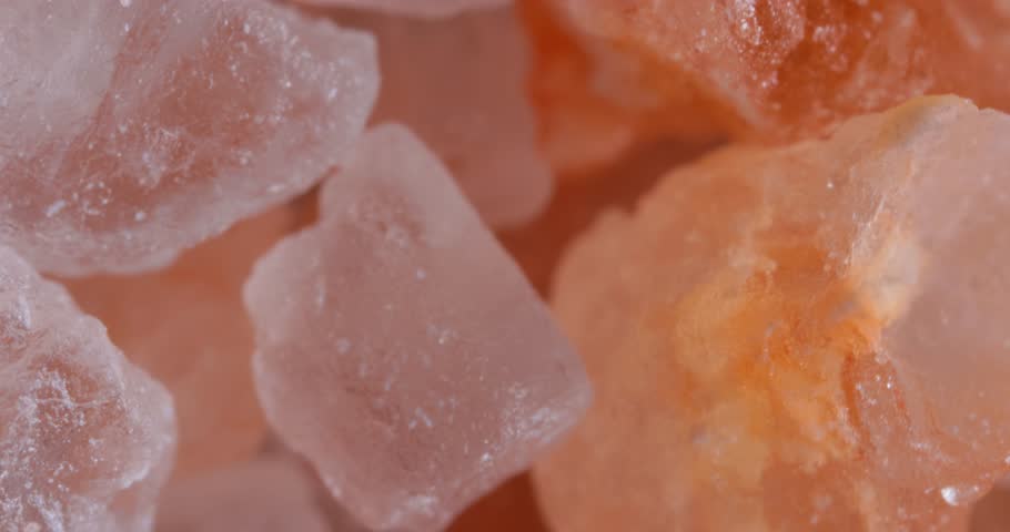 Himalayan pink salt Super Macro Close Up. Due mainly to marketing costs, pink Himalayan salt is up to twenty times more expensive than table or sea salt. Royalty-Free Stock Footage #1101837779