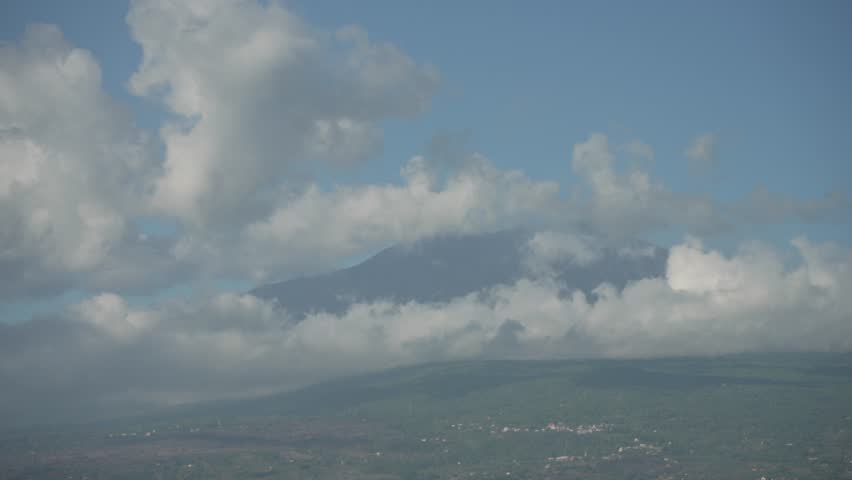White clouds over Mount Etna viewed from Giardini Naxos, Taormina, Messina, Sicily, Italy, Mediterranean, Europe