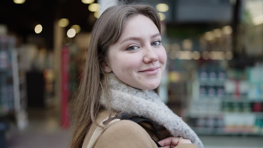 Young blonde woman smiling confident standing at street | Shutterstock HD Video #1101850737