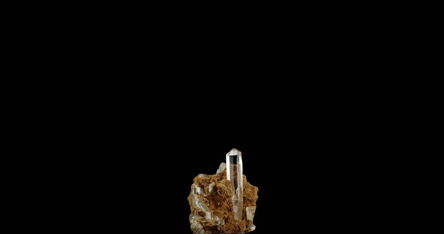 colorless gem quality topaz on matrice. macro detail texture background. close-up raw rough unpolished semi-precious gemstone