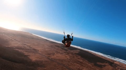 Fly Paragliding in Morocco ocean coast in sunny summer adventure, Extreme sport freedom flight Stockvideó