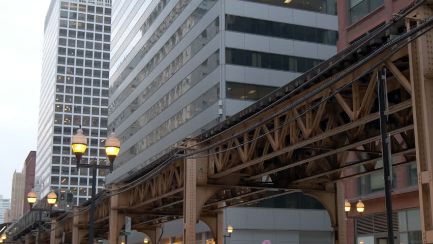 Metra train move in Chicago Magnificent Mile street on a night time. CHICAGO, USA 