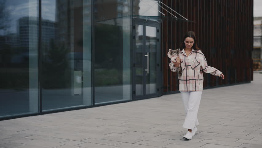 Happy Caucasian Woman Walking with Pet Friend, Dancing, Hugging Adorable Chihuahua on Her Hands Listening to Music Feeling Happy, Having Fun, and Dancing. People Dog Friendship Concept | Shutterstock HD Video #1101865317