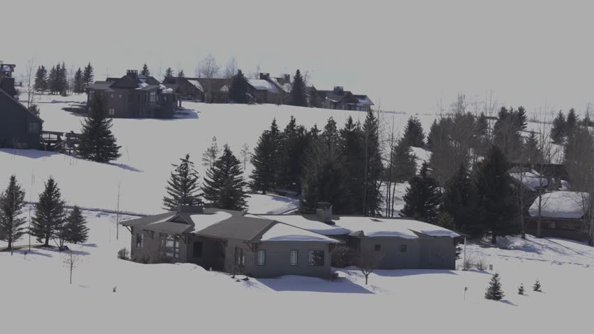 houses in winter landscape after a storm