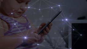Animation of networks of connections with icons over toddler using smartphone. global technology, digital interface and connections concept digitally generated video.