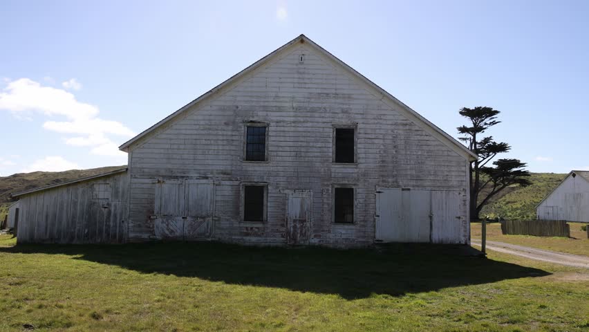 Rustic wooden barn with faded white paint on historic Pierce Point Ranch | Shutterstock HD Video #1101872647