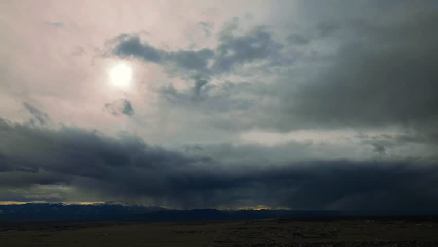 Drone Time Lapse View of a Storm Hovering Over Pikes Peak 4K features a view from a drone flying at over 7,000 ft elevation for a time-lapse view of a storm over Pike Peak.