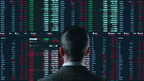 Trader is working with computer. Screen with stock charts and data analysis. Broker trading online. Concept of bitcoin BTC and stock market or crypto trading. - Powered by Shutterstock - Get 15% off with code: PIKWIZARD15