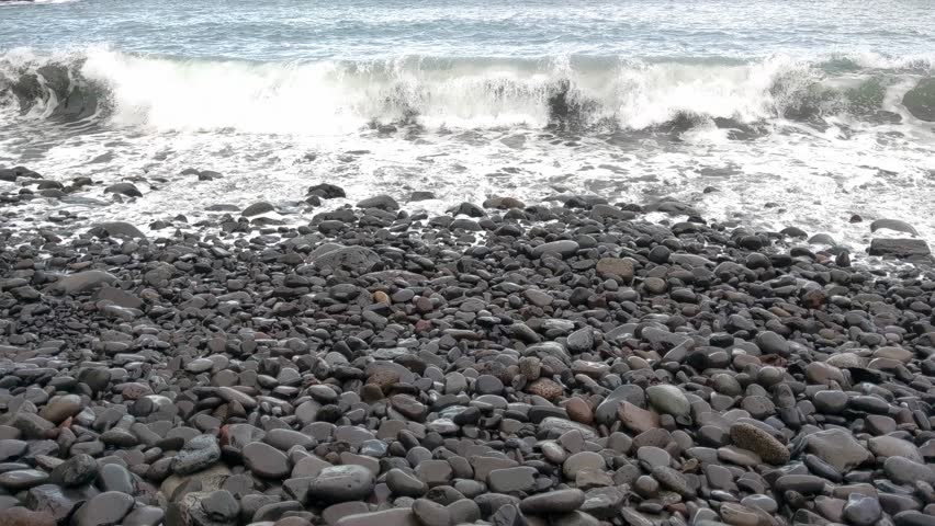 Rocky beach coast. Rest on the sea. The wave washes the stones. | Shutterstock HD Video #1101873633