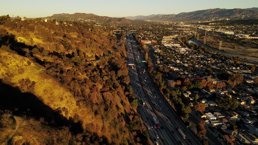 Aerial shot of the 5 freeway as it runs through the Elysian Valley in Los Angeles | Shutterstock HD Video #1101876825