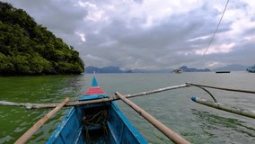 Philippine Sea - Fisherman Catamaran Passing Islands and Tour Boats - Cloudy Day