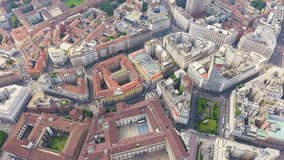 Inscription on video. Milan, Italy. Roofs of the city aerial view. Cloudy weather. Text from small balls, Aerial View