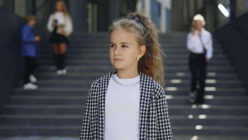 Portrait of the Beautiful Young Businesswoman Standing near the Business Center. Female Kid Employee near the Workspace, Looking at the Camera. Girl After School
