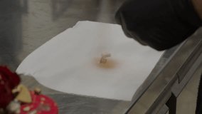 chef spray gold paint on key shaped chocolate cake topper 4k footage - Powered by Shutterstock - Get 15% off with code: PIKWIZARD15