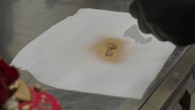 chef spray gold paint on key shaped chocolate cake topper 4k footage - Powered by Shutterstock - Get 15% off with code: PIKWIZARD15