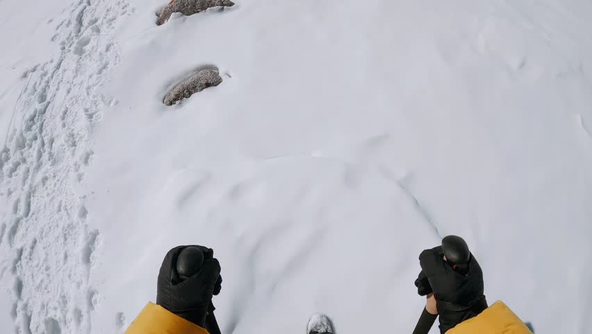 Hiking shoes POV walk on snow on winter hike, explorer boots leave footprints on fresh snow. Walking or hiking during winter season in mountains or forest. Winter outdoor activities | Shutterstock HD Video #1101886789