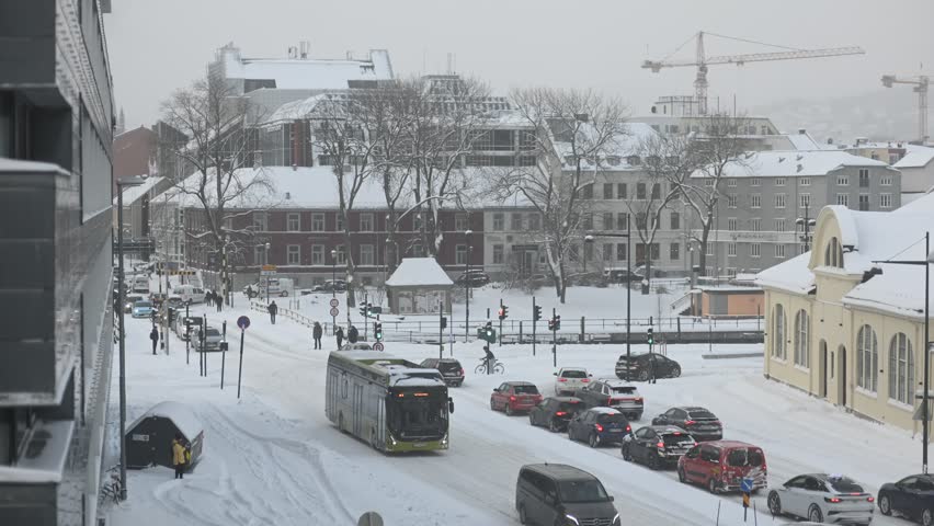 Time-lapse video 4k: Traffic on the crossroad of the Norwegian city Trondheim in winter
