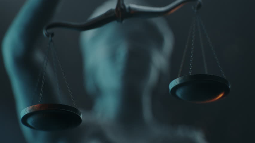 Cinematic and Atmospheric Zoom in Shot of Lady Justice Sculpture Face. The Statue is Blindfolded and Holding Scales and Sword.
A Title Sequence for Court Show Mock-up. Royalty-Free Stock Footage #1101891145