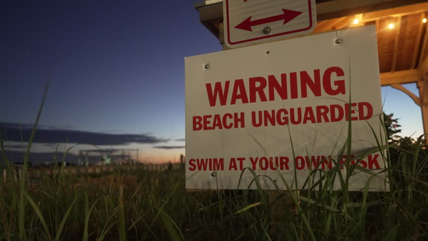 WARNING Sign - Beach Unguarded, Swim at Your Own Risk - Lighthouse Cove Event Center - Dewey Beach, DE