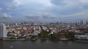 Bangkok old town on river new town in background. Amazing aerial view flight. Phra Sumen Fort, thailand 2022. boom sliding to right drone
4k uhd cinematic footage.