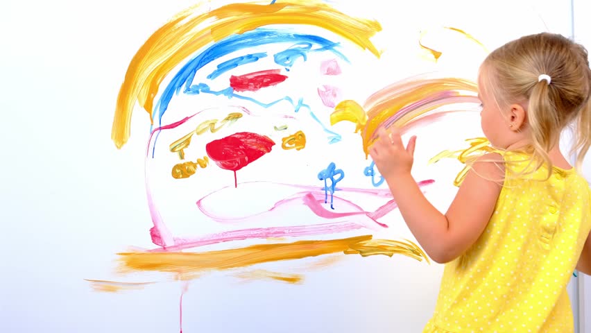 Child enthusiastically draws with artistic brush confident strokes paint on white wall home, blonde preschool girl in yellow dress paints rainbow, flowers, childish naive drawing, happiness childhood | Shutterstock HD Video #1101892771