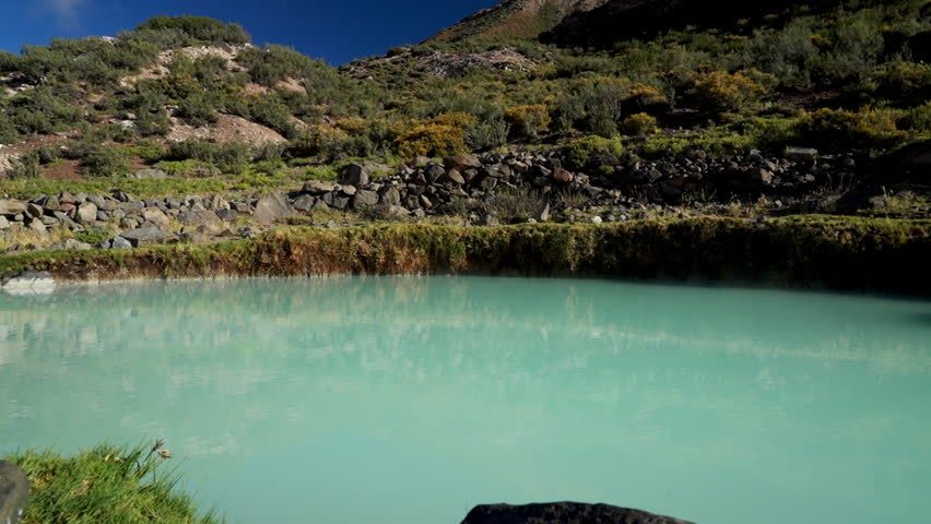 pool at a sulfuric spy spring at old abandoned ruins of Hotel at the Termas del Sosneado in the andean Mountains of Argentina, South America.