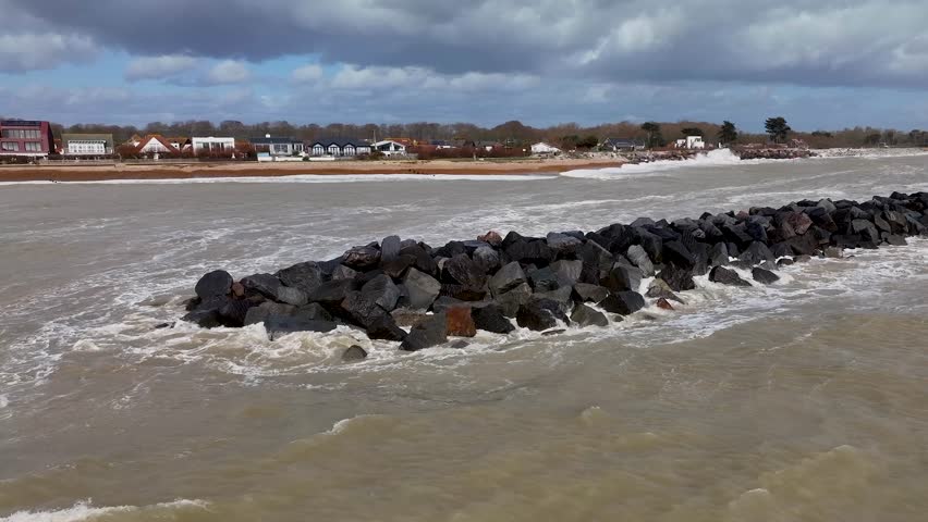 Elmer beach breakwater. Bognor Regis. Cinematic drone flight