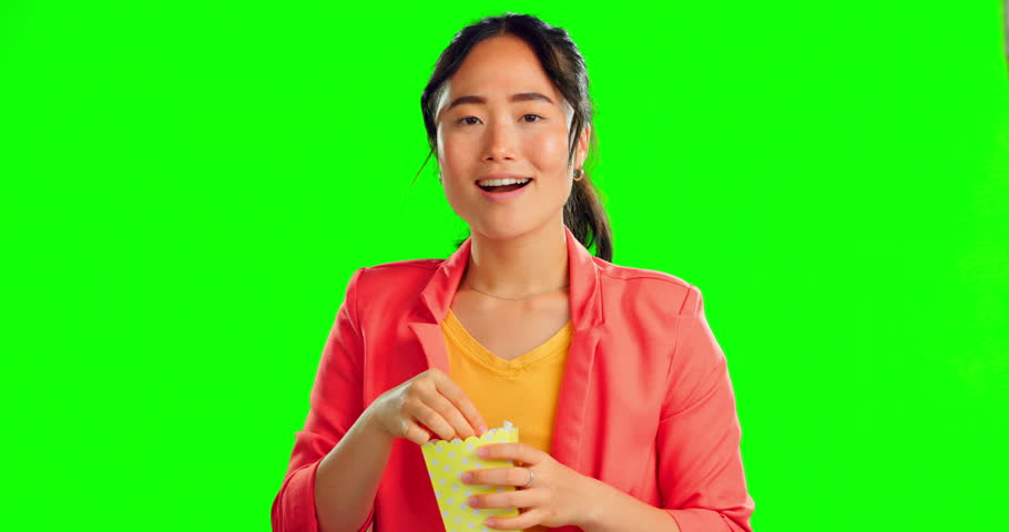 Popcorn, movie and eating with woman in green screen studio for film, cinema and streaming. Watching tv, theater and food with female on background for television, entertainment and subscription Royalty-Free Stock Footage #1101901321