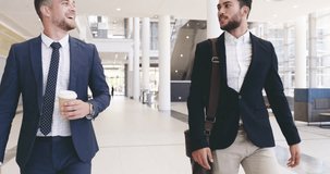 Make positive connections that will benefit you. 4k video footage of handsome young businessmen shaking hands in the convention centre.