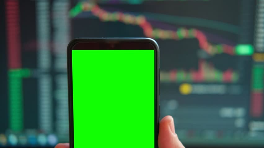 Black phone with blank mockup screen on rising stock graph. Closeup hand showing smartphone isolated green display. Online banking, Fund App use. Financial analyst on Invest Market. Bank collapse 2023 Royalty-Free Stock Footage #1101907913
