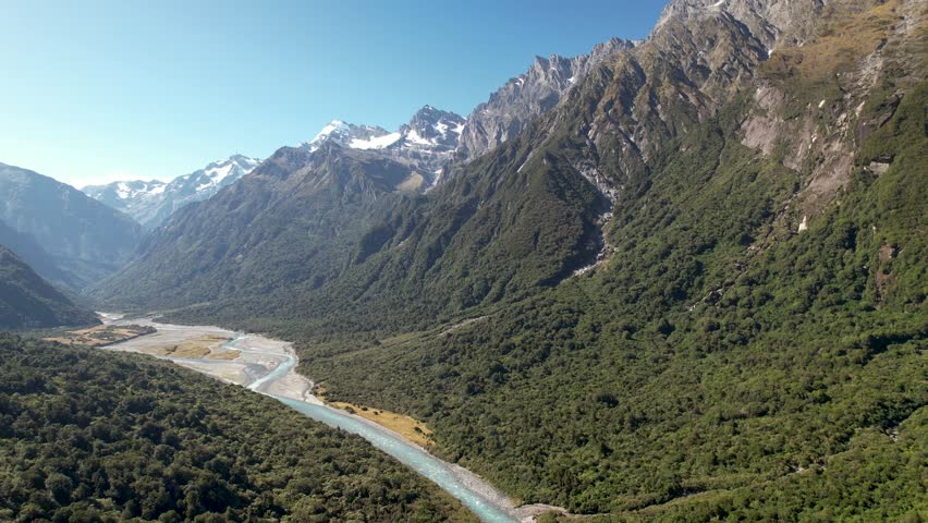 Copland river, valley and mountain vista. Beautiful natural scenery of New Zealand - aerial